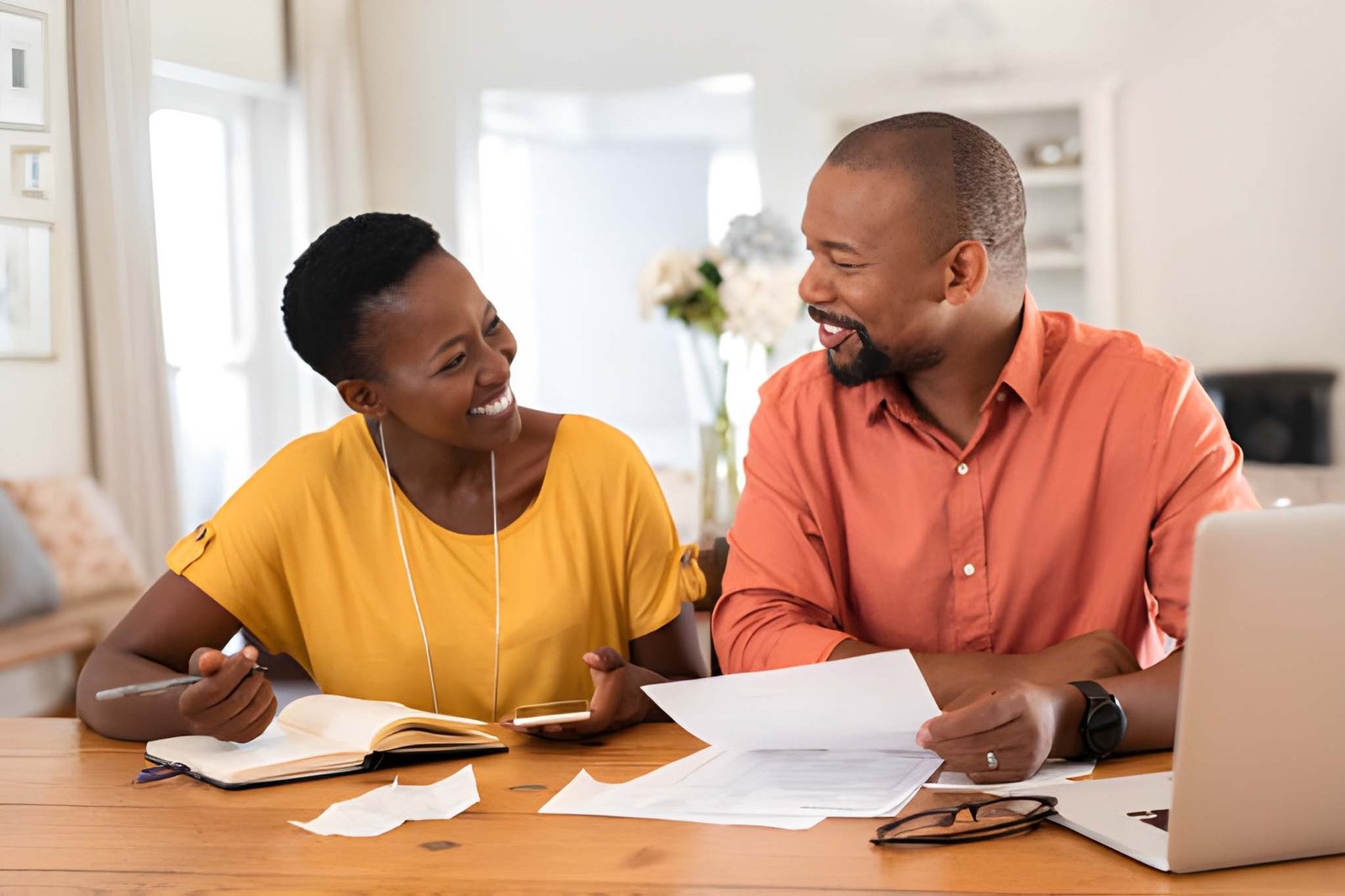 A couple at home reviewing their car insurance options together